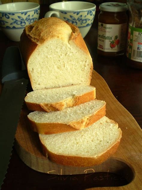 Sliced Loaf Of Bread Sitting On Top Of A Cutting Board