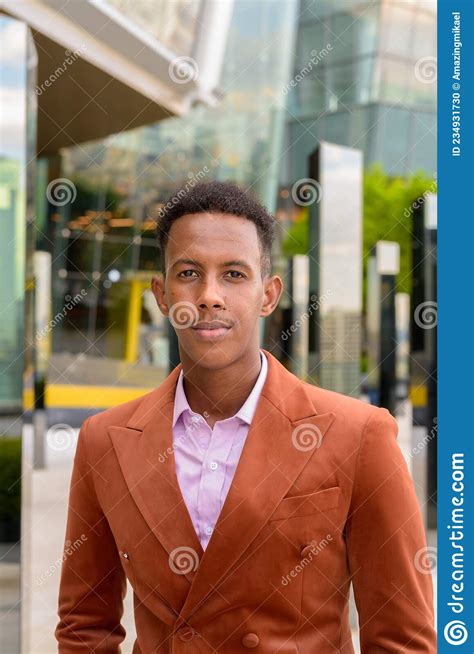 Portrait Of Handsome Black African Businessman Outdoors In City Stock