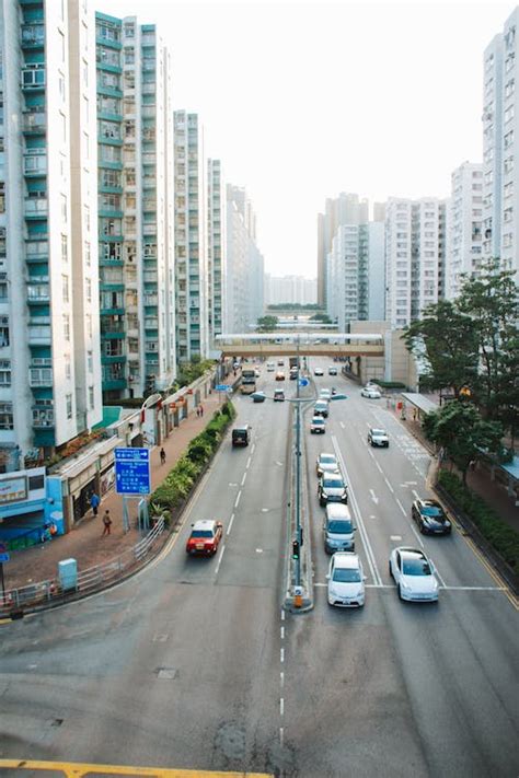 City Road in Between Concrete Buildings · Free Stock Photo