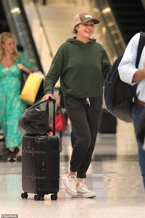 Shannen Doherty Pictured In Good Spirits At Lax Amid Her Stage Cancer