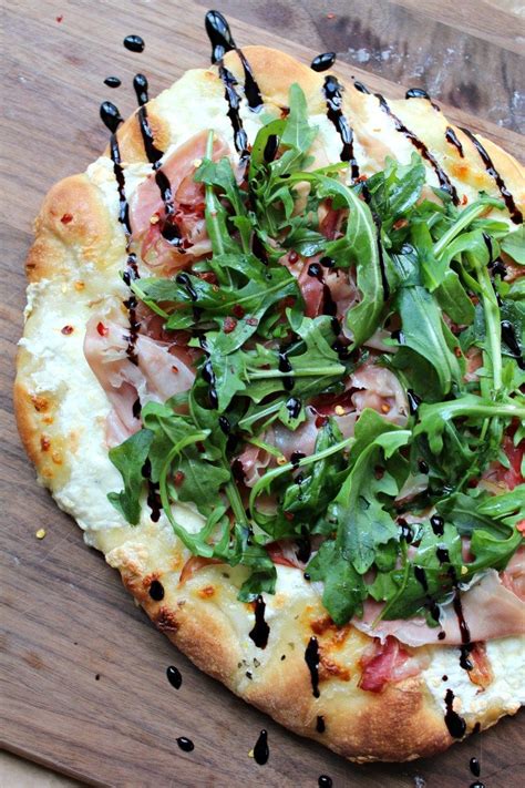 Easy Homemade Delicious Pizza Crust Topped With Prosciutto Arugula And Burrata Finished With