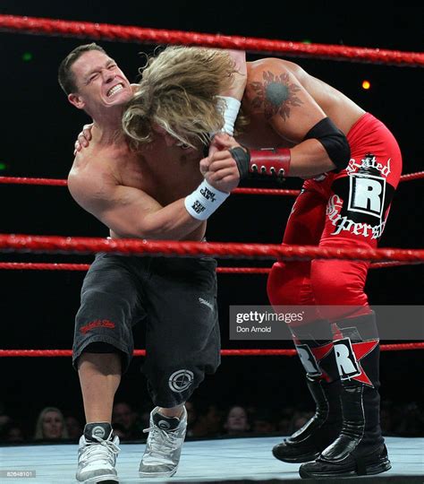 John Cena and Edge Lita lock horns during the WWE RAW Superslam event ...