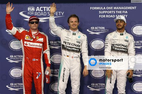 L To R Kimi Raikkonen Fin Ferrari Pole Sitter Nico Rosberg Ger