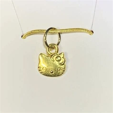 Small Gold Hello Kitty Charm Pendant On A Gold Snake Necklace Chain