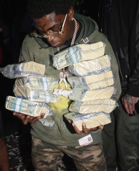 Rappers Holding Money