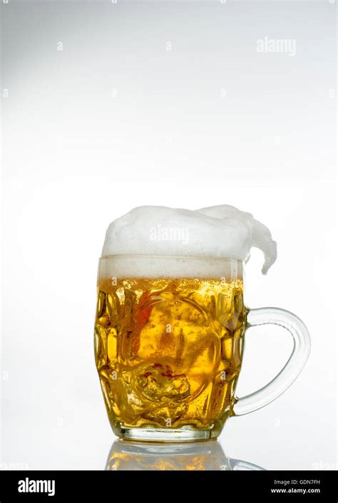 Frosty Glass Of Light Beer Set Isolated On A White Background Stock