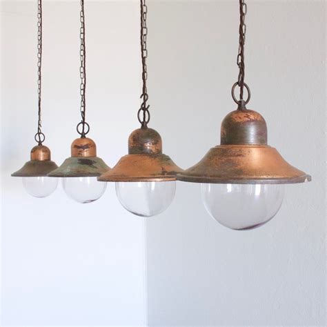 A set of 5 copper pendant lights