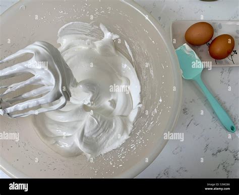 Whisking egg whites Stock Photo - Alamy