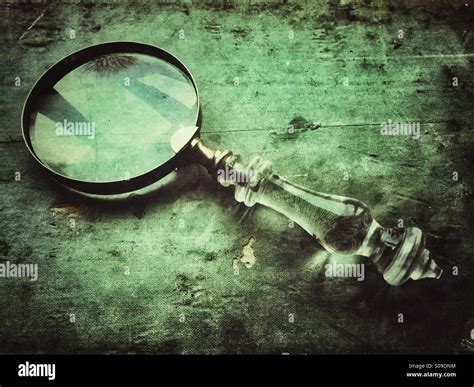 Vintage magnifying glass Stock Photo - Alamy