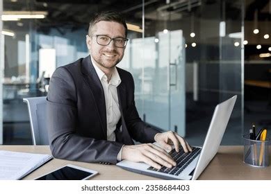 Portrait Young Man Sitting Desk Office Stock Photo 2358684403 ...