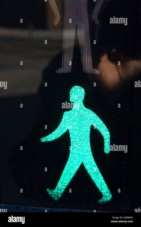 traffic sign green man walking pedestrian crossing Stock Photo - Alamy