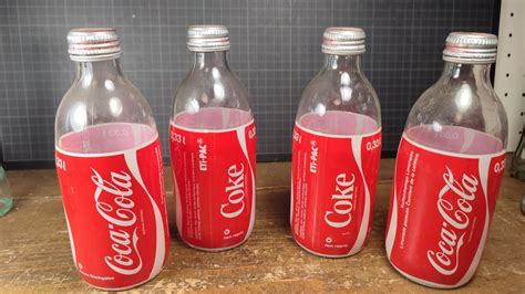 4 Wunderschöne alte COCA COLA FLASCHEN 1984 Kaufen auf Ricardo