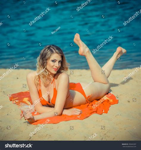Girl Orange Bikini Sunning On Beach Stock Photo Shutterstock