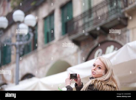 Blonde Tourist Taking Photographs In The City Stock Photo Alamy
