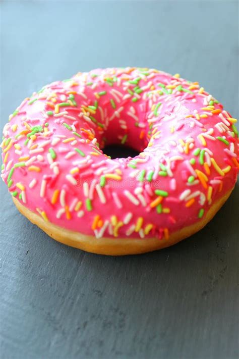 Pink Doughnut with Sprinkles on Black Background Stock Image - Image of ...