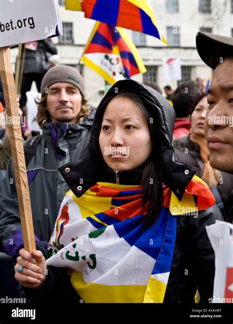 Tibetan Woman Wearing A Flag Protesting At The Free Tibet Demo Against