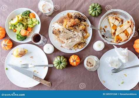 Top View Of Thanksgiving Table After Feast Leftovers And Dirty Dishes