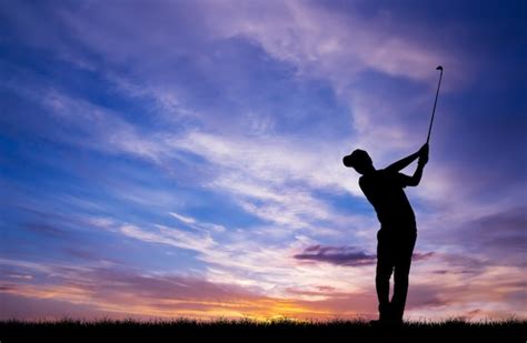 Premium Photo | Silhouette golfer playing golf during beautiful sunset