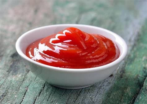 Premium Photo | Close-up of red soup in bowl on table