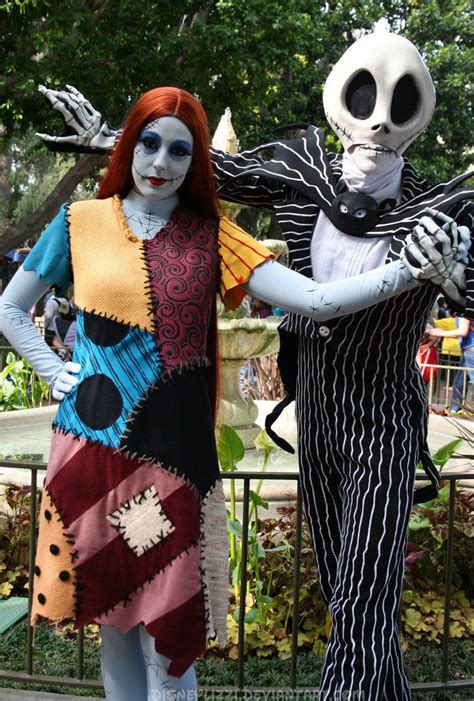 Two People In Costumes Standing Next To Each Other