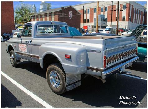 An Old Pickup Truck Parked In A Parking Lot