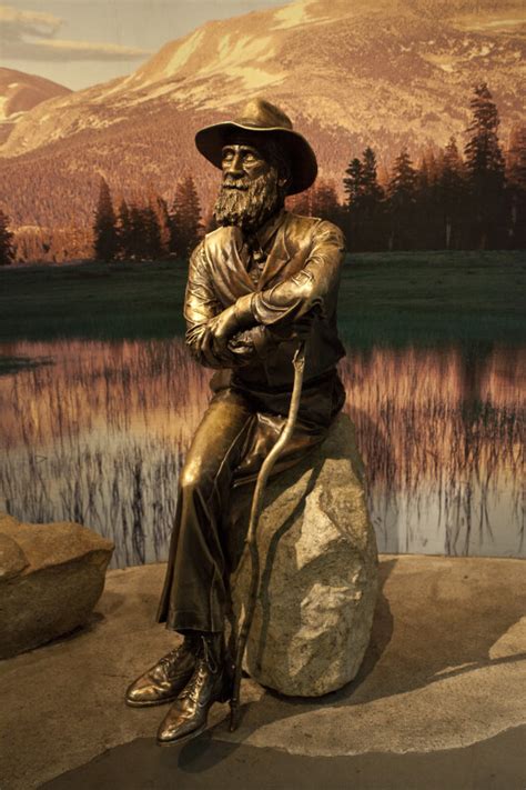 A Bronze Sculpture Of John Muir Seated On A Rock Clippix Etc