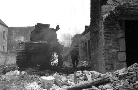 A Canadian Soldier Runs Past A Burning Sherman Of The South Alberta Regiment 4th Canadian