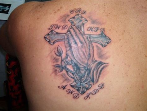 Cross with hands of prayer tattoo - Tattooimages.biz