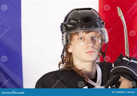 Jugador Del Hockey Sobre Hielo Sobre El Indicador De Francia Imagen De