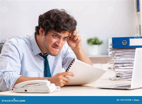 Overloaded Busy Businessman Having Lunch At Work Stock Image