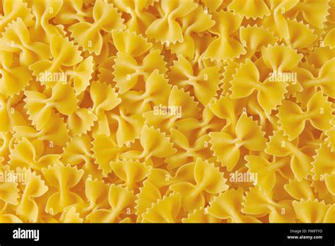 Background Of Uncooked Bow Tie Pasta Stock Photo Alamy