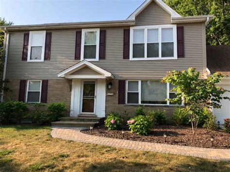 Stunning Tan House With Maroon Shutters A Jaw Dropping Curb Appeal Transformation