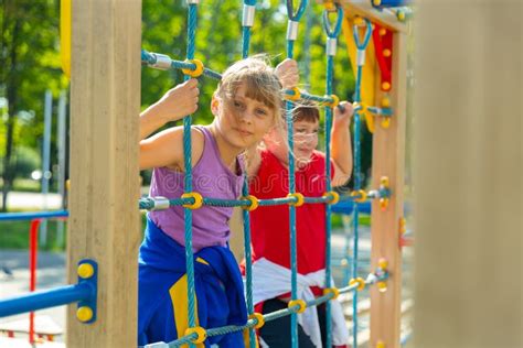 Portrait Of Happy Girlfriends Playing Outdoors On Playground Stock Image Image Of Laughing