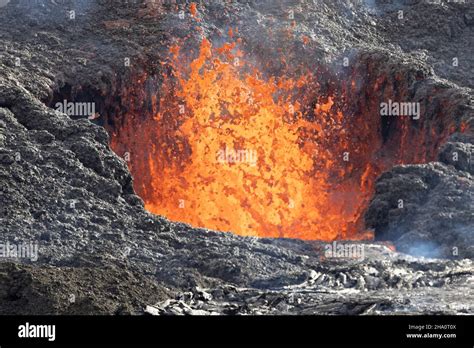 volcano caldera in eruption with lava Stock Photo - Alamy