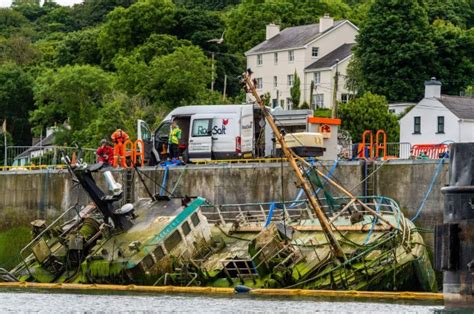 Dramatic Images Show Ship Being Pulled By Crane From Cork Harbour After