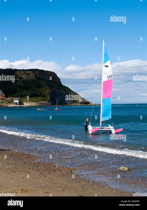 Beach At Runswick Bay With A Sailing Catamaran Being Prepared For Sea