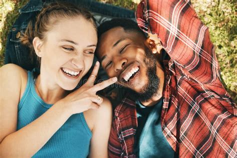 Interracial Couple Park Selfie And Peace On Grass With Love Happiness And Relax On Holiday