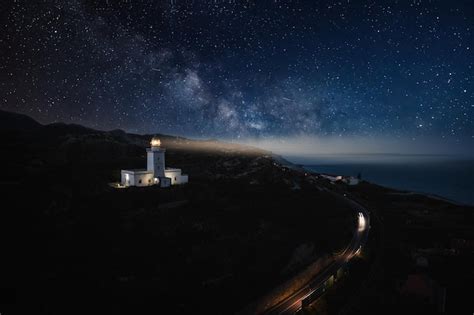 Premium Photo | Lighthouse by night aerial view