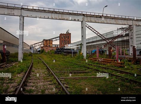 Outdated Soviet Plant Exterior Rails Concrete Crane Bridge And Brick