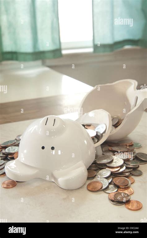 Broken piggy bank Stock Photo - Alamy