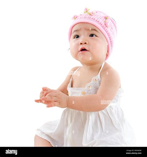 Portrait Of Cute Asian Baby Girl Looking Up Isolated On White