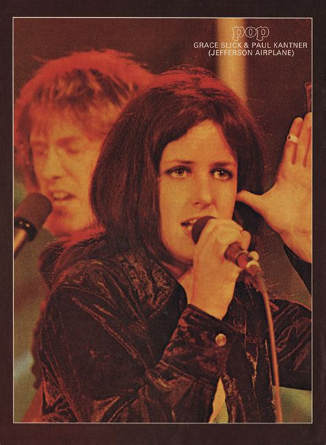 An Old Photo Of A Woman Singing Into A Microphone And Another Person