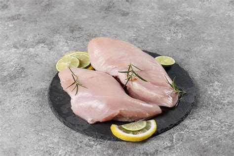 Premium Photo | Daging Dada Ayam Mentah or Raw Chicken Breasts with ...