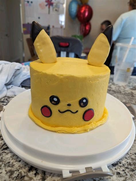 Pikachu Birthday Cake With Pokeball Cake Pops In Pokeball Cake