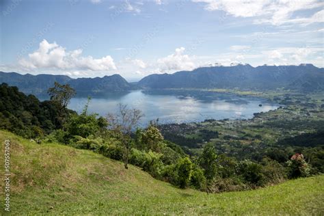 Danau Maninjau is an impressive volcanic lake at the bottom of an ...