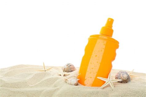 Premium Photo Sunscreen With Starfish And Seashells On Clear Sea Sand