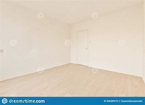 An Empty Room with White Walls and Wood Floors Stock Image - Image of ...