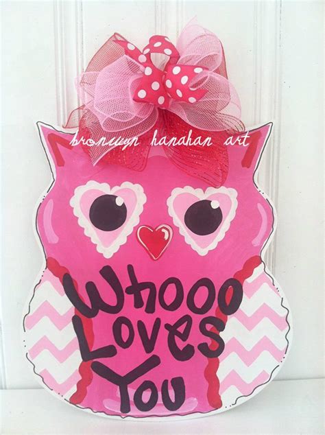 A Pink Owl Door Hanger That Says Who Loves You