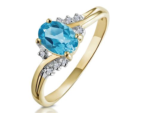 Yellow Gold Blue Topaz Rings The Diamond Store