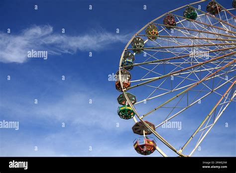 Detail Of A Ferris Wheel Background Blue White Sky Stock Photo Alamy